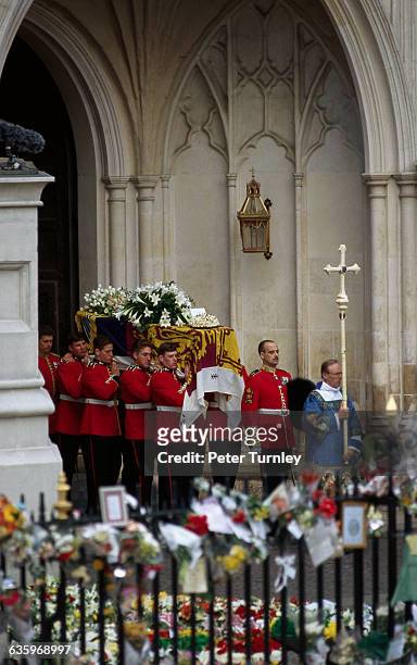 Guardsmen of the Prince of Wales Company of the Welsh Guards carry Diana's casket out of Westminster Abbey following the funeral of Diana, Princess...