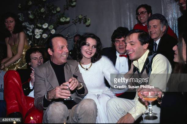 Maria Burton, adopted daughter of Richard Burton and Liz Taylor, attends a house party with celebrity and fashion photographer Francesco Scavullo and...
