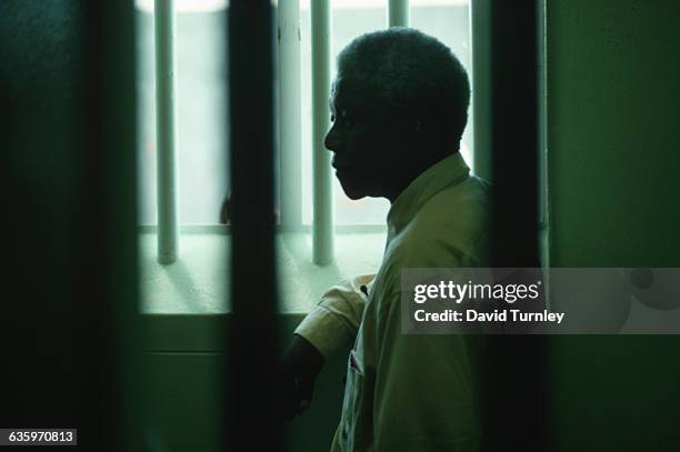 Nelson Mandela in his confinement cell where he had been incarcerated for twenty seven years for his views in opposition fo the apartheid regime.