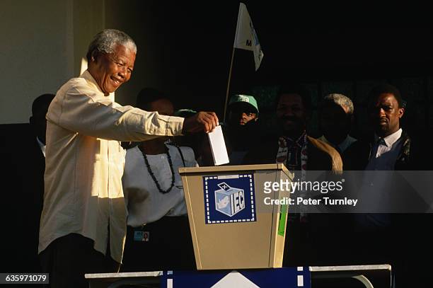 African National Congress presidential candidate Nelson Mandela votes in the first democratic elections in South Africa. Mandela, the anti-apartheid...