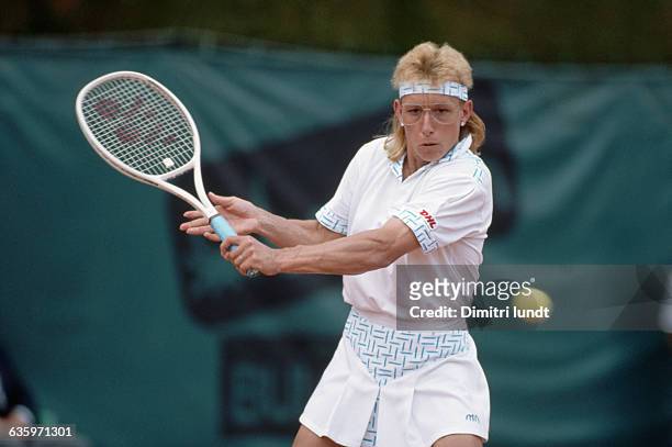 American tennis player Martina Navratilova prepares to hit a slice backhand during a match at the French Open.