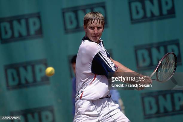 Yevgeni Kafelnikov prepares to hit a backhand stroke during a match at the 1996 French Open.