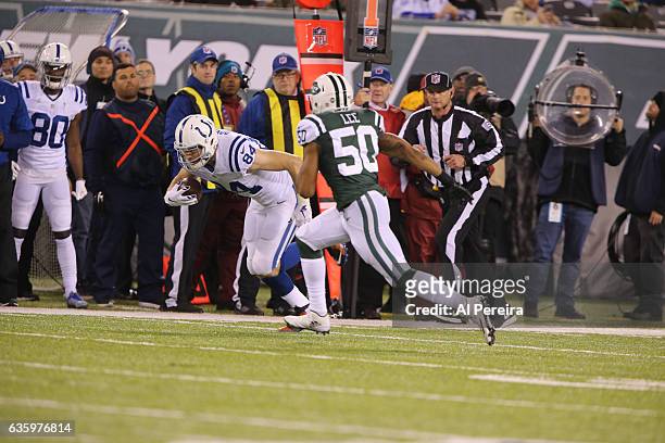 Tight End Jack Doyle of the Indianapolis Colts has a long gain against the New York Jets during their game at MetLife Stadium on December 5, 2016 in...