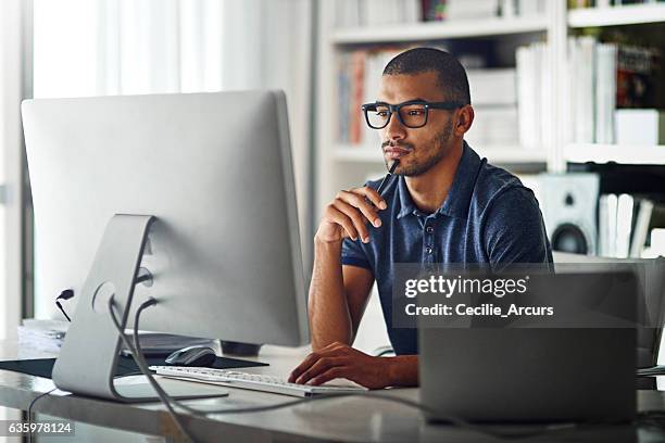 learning the ropes of his industry through first-hand experience - office concentration stock pictures, royalty-free photos & images