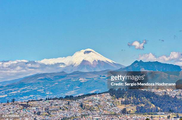 cotopaxi volcano as seen from the very north of quito, ecuador - cotopaxi stock-fotos und bilder