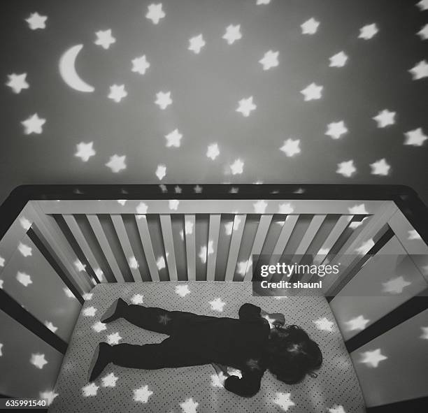 sleeping in the stars - nursery night stock pictures, royalty-free photos & images