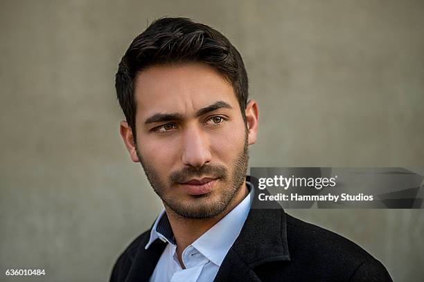 portrait of young man looking away against gray background - real businessman isolated no smile stock pictures, royalty-free photos & images