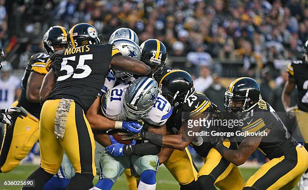 Running back Ezekiel Elliott of the Dallas Cowboys is tackled by linebackers Arthur Moats and Lawrence Timmons and safeties Mike Mitchell and Robert...