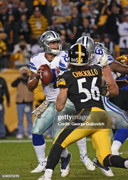 Quarterback Dak Prescott of the Dallas Cowboys looks to pass as offensive lineman Doug Free blocks linebacker Anthony Chickillo of the Pittsburgh...