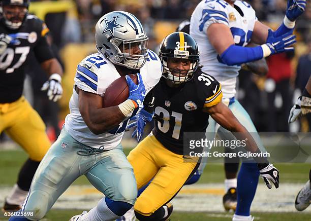 Running back Ezekiel Elliott of the Dallas Cowboys runs with the football against cornerback Ross Cockrell of the Pittsburgh Steelers during a game...