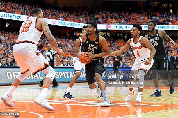 Rodney Pryor of the Georgetown Hoyas drives to the basket between DaJuan Coleman and John Gillon of the Syracuse Orange during the first half at the...