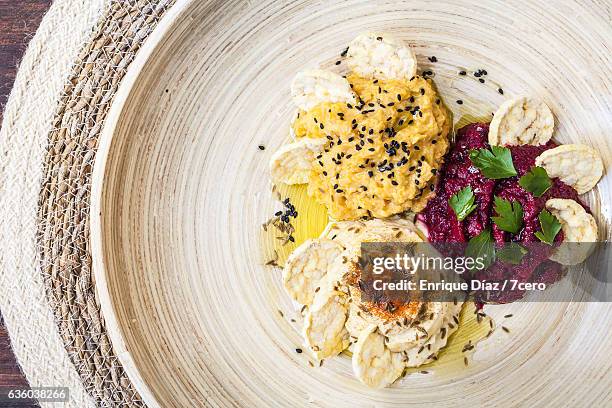 pumpkin, chickpea and beetroot hummus trio with crackers - pumpkin oil stock pictures, royalty-free photos & images