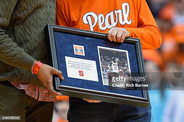 General view of a plaque presented to the family of former player Pearl Washington following a halftime presentation to honor Washington against the...