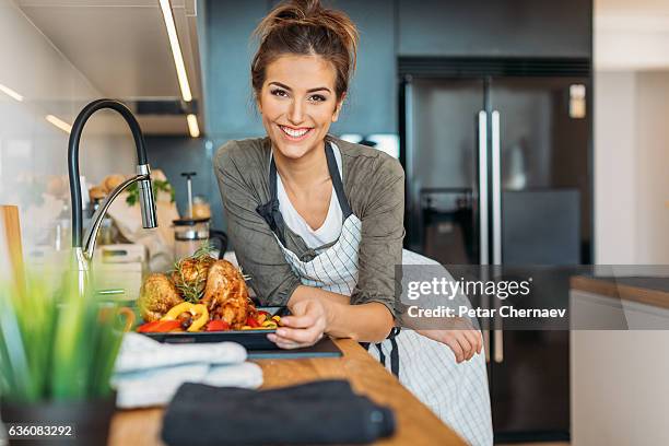 ready for thanksgiving - young woman cooking in kitchen stock pictures, royalty-free photos & images