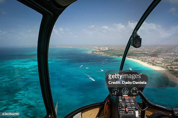 eagle beach from helicopter - aruba beach stock-fotos und bilder