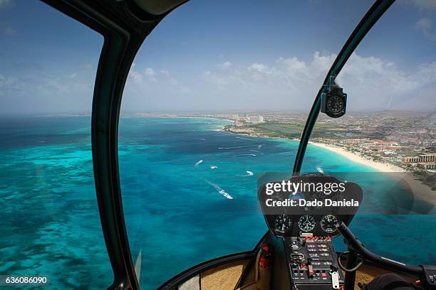 eagle beach from helicopter - helicopter cockpit stock pictures, royalty-free photos & images