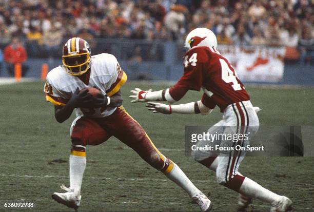Wide Receiver Art Monk of the Washington Redskins catches a pass against the St. Louis Cardinals during an NFL game November 6, 1983 at RFK Stadium...