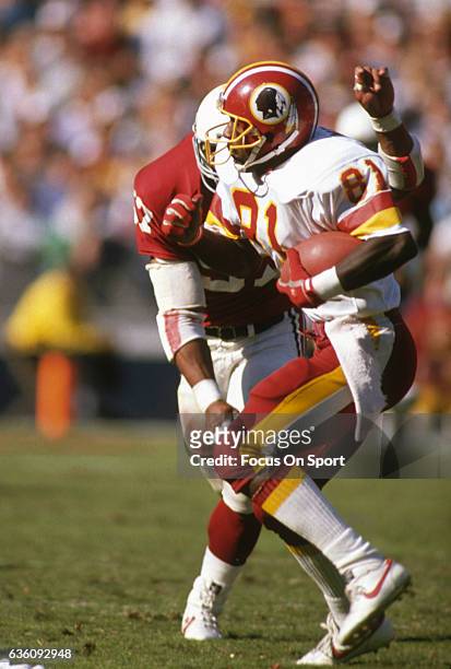 Wide Receiver Art Monk of the Washington Redskins runs with the ball after catching a pass against the St. Louis Cardinals during an NFL game October...