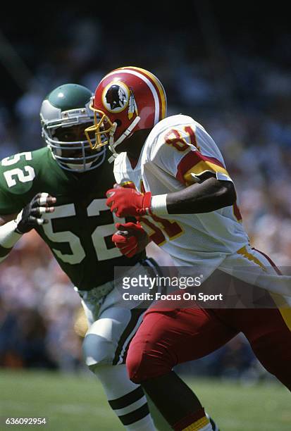 Wide Receiver Art Monk of the Washington Redskins in action against the Philadelphia Eagles during an NFL game circa 1983 at RFK Stadium in...