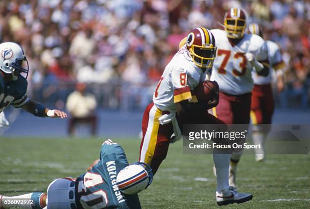 Wide Receiver Art Monk of the Washington Redskins runs with the ball after catching a pass against the Miami Dolphins during an NFL game circa 1993...