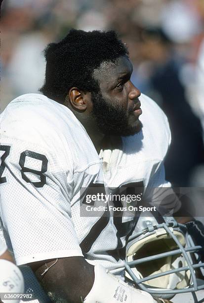 Offensive tackle Art Shell of the Oakland Raiders looks on from the bench against the New York Jets during an NFL football game October 23, 1977 at...