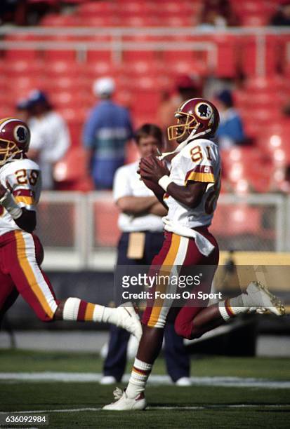 Wide Receiver Art Monk of the Washington Redskins warms up during pregame warm up prior to the start of an NFL game circa 1993 at RFK Stadium in...