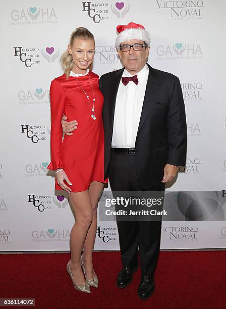 Hannah Noval and Victorino Noval attend the Victorino Noval Foundation Christmas Party on December 17, 2016 in Beverly Hills, California.