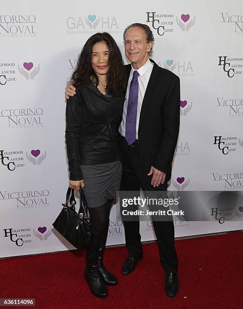 Wendy Rogers and Barry Axelrod attend the Victorino Noval Foundation Christmas Party on December 17, 2016 in Beverly Hills, California.