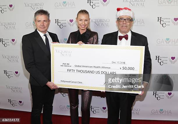 Dr. Alex Gershman, Hannah Noval and Victorino Noval attend the Victorino Noval Foundation Christmas Party on December 17, 2016 in Beverly Hills,...