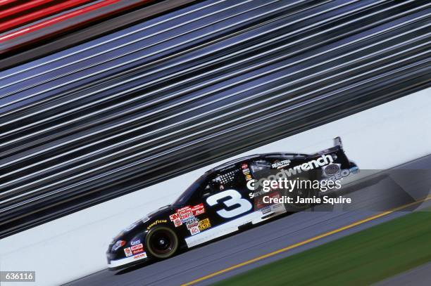 Dale Earnhardt who drives the Chevy Monte Carlo for Richard Childress Racing pulls out of a turn during the Daytona 500 Speedweeks, part of the...