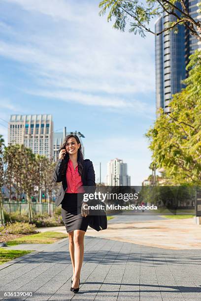 hispanic business women walking downtown san diego - san diego street stockfoto's en -beelden