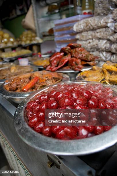 Cherries And Pickles For Sale At Market.india.