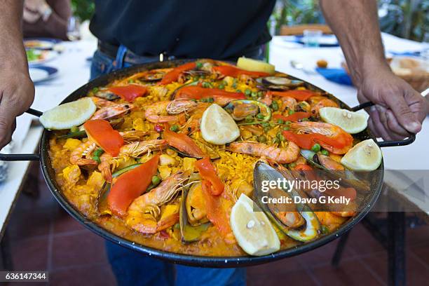 seafood paella - paella stock-fotos und bilder