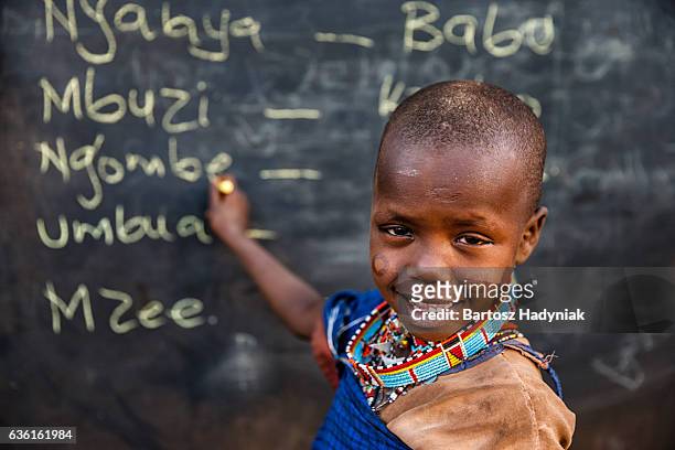 little african girl during swahili language class, east africa - kenyansk kultur bildbanksfoton och bilder