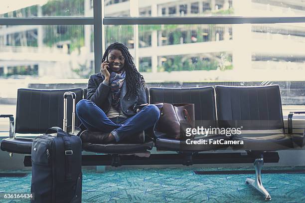 gorgeous ethnic young adult female traveling - airport hipster travel stockfoto's en -beelden