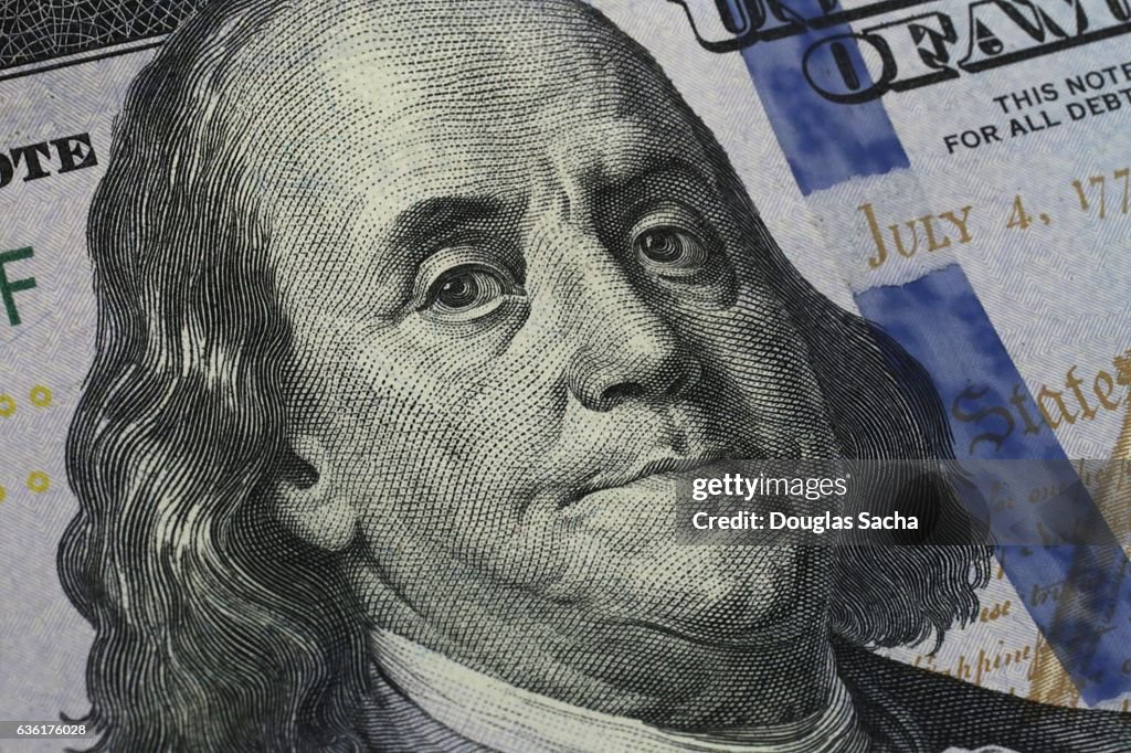 Closeup of Benjamin Franklin's portrait on the One Hundred Dollar Bill