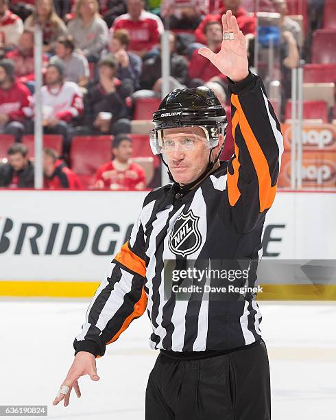 Referee Kelly Sutherland watches the lines changes during an NHL game between the Detroit Red Wings and the Anaheim Ducks at Joe Louis Arena on...