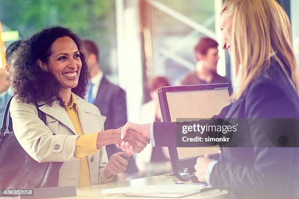 bank counter - handshaking in a bank stock-fotos und bilder