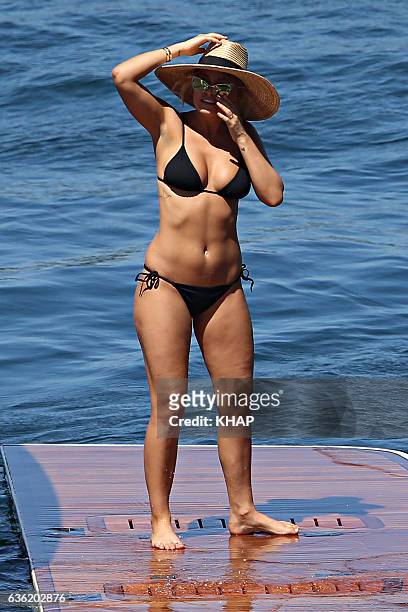 Lara Bingle enjoys a day out on a boat on Sydney Harbour with friends on October 10, 2013 in Sydney, Australia.