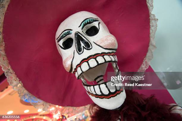 papier-mâché skulls are used during the celebration of dia de muertos a holiday honoring the deceased in mexico. - todos santos stockfoto's en -beelden