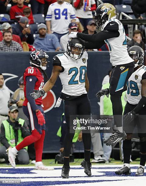 Prince Amukamara of the Jacksonville Jaguars celebrates with Jalen Ramsey of the Jacksonville Jaguars after breaking up a pass in the end zone...