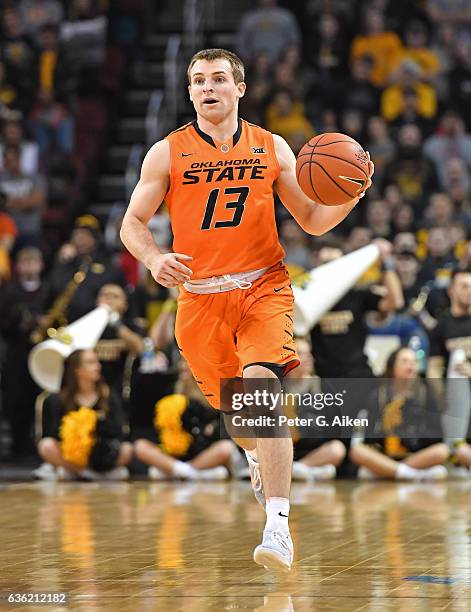 Guard Phil Forte III of the Oklahoma State Cowboys dribbles up court against the Wichita State Shockers during the first half on December 17, 2016 at...