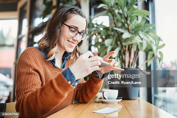 check remote deposit capture at cafe - check bildbanksfoton och bilder