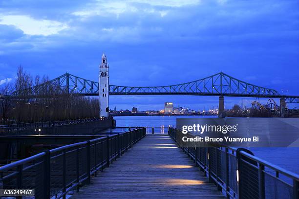 montreal clock tower and jacques cartier bridge - montreal clock tower stock pictures, royalty-free photos & images