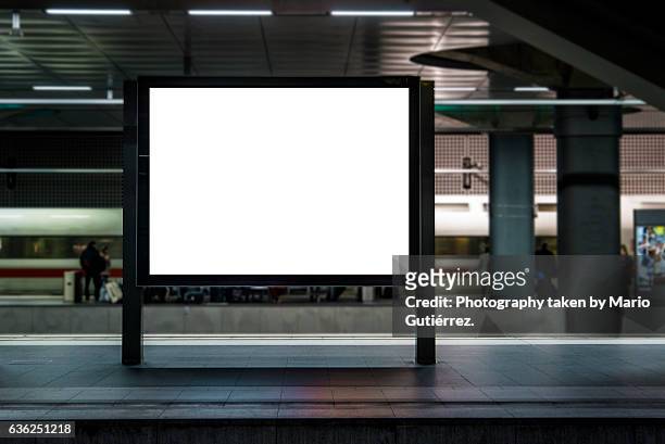 billboard at station - placard imagens e fotografias de stock