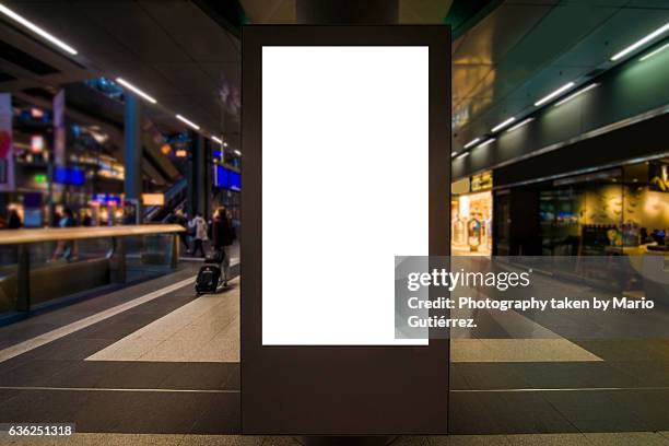billboard at station - sidewalk sign stock pictures, royalty-free photos & images