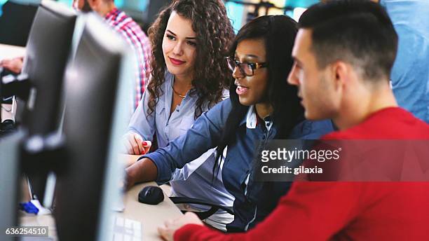 application developers at work. - man and machine stock pictures, royalty-free photos & images