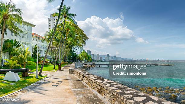 pier over sea against cloudy sky,penang, malaysia - penang stock pictures, royalty-free photos & images