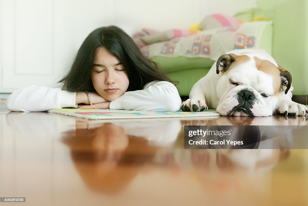 Girl laying with slept dog
