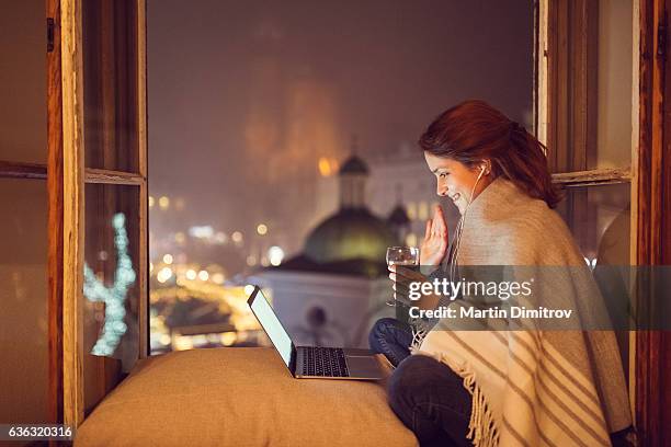 young woman at home enjoying a video call - zoom dating stock pictures, royalty-free photos & images